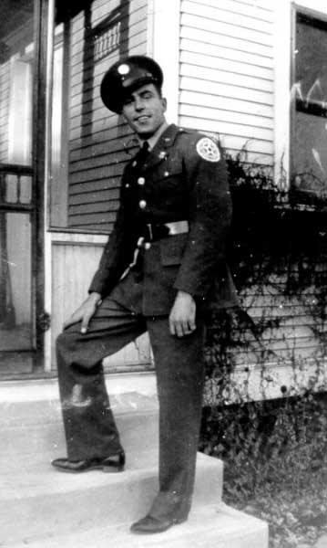 Roy on back steps to house in Aurora NE circa 1941